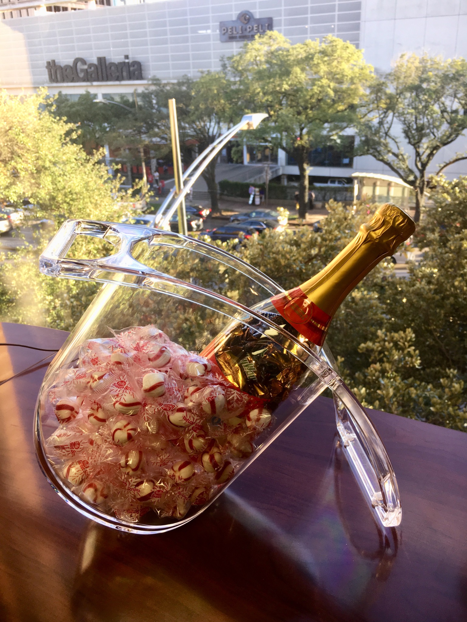 Coolin Curve presented as a gift with a bottle and wrapped peppermint candies