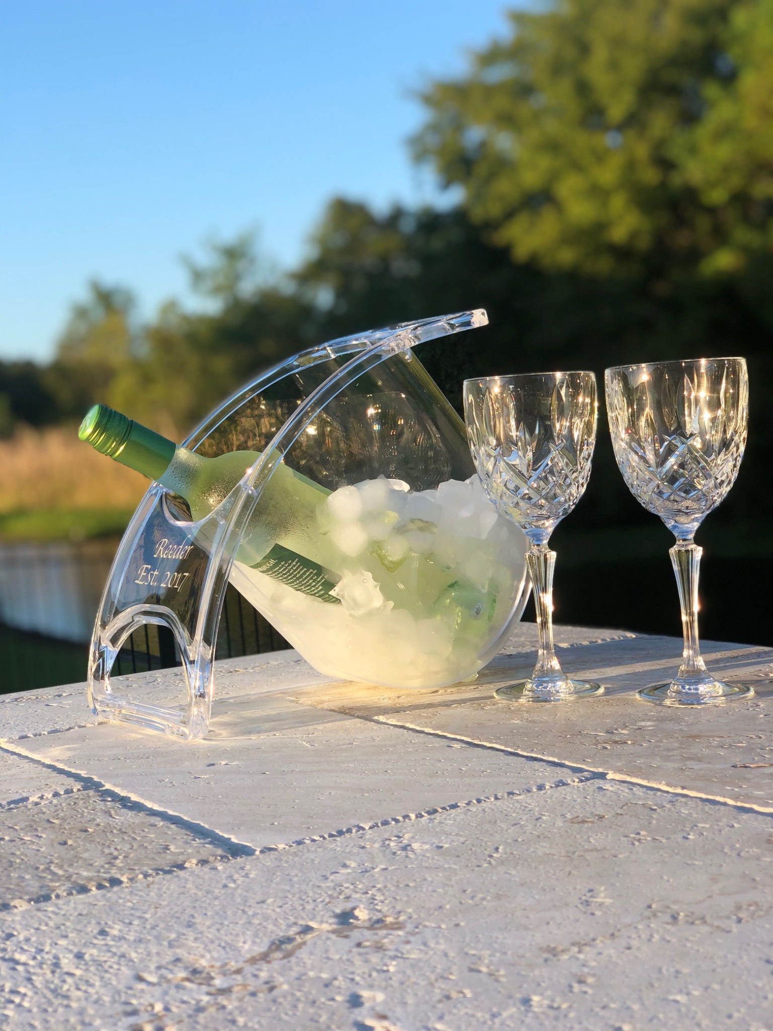 Personalized Coolin Curve with wine and two glasses on a sunny patio