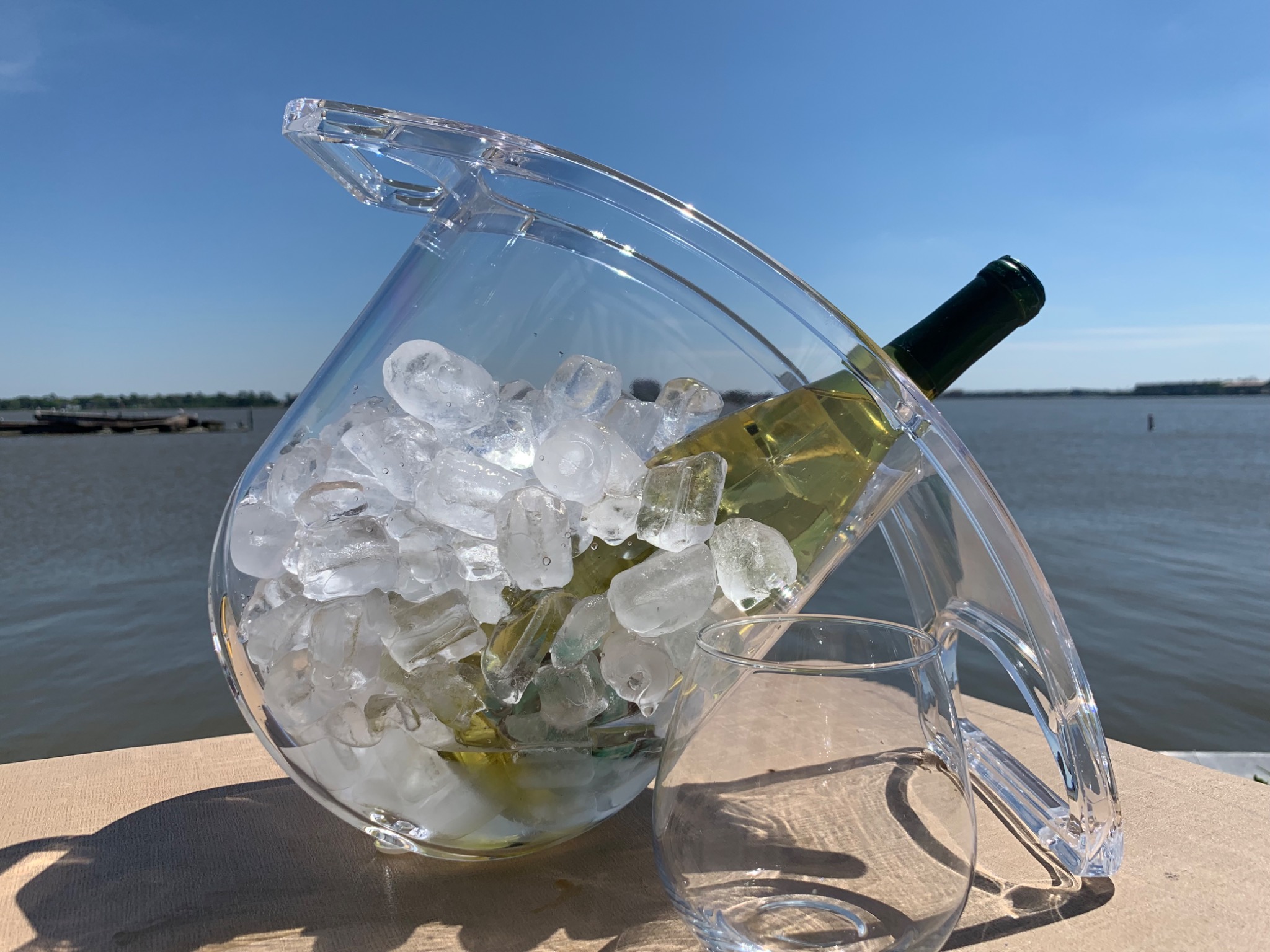 Coolin Curve keeping a wine bottle in ice beside the water