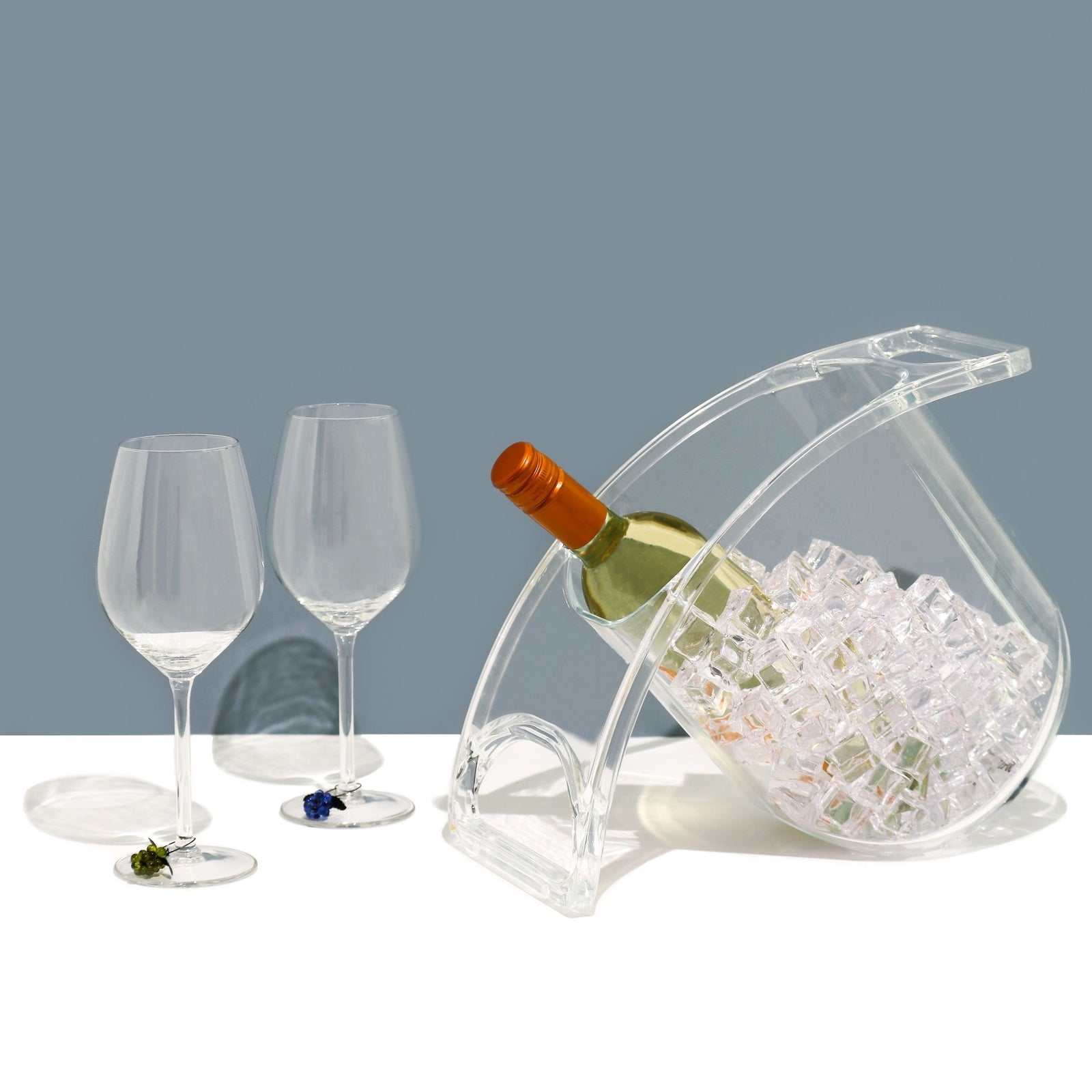 Clear Coolin Curve beverage chiller tilted with a wine bottle nestled in ice